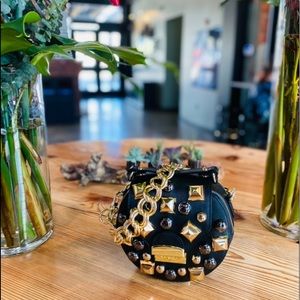 Gold! This beautiful crossbody leather tote with chain strap